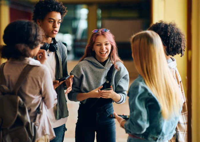 cheerful-high-school-students-having-fun-while-tal-2023-11-27-04-51-59-utc